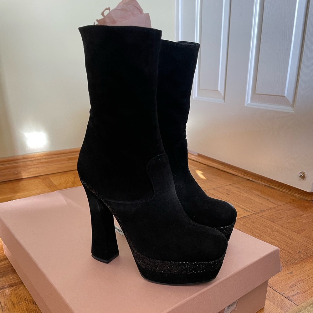 In excellent condition, MiuMiu sued leather